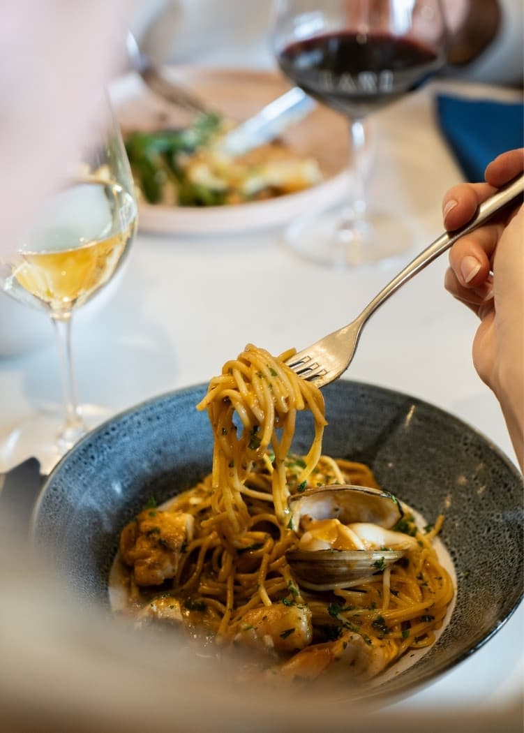 Guests sharing pasta at Earl on a Tuesday night